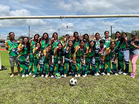 DAVRAA FOOTBALL CHAMPS. Members of the Davao Eagles secondary girls’ football team show their gold medals after winning the championship during the Davao Regional Athletic Association (Davraa) Meet 2026 in Tagum City in February 2026. The team will represent Region 11 in the Palarong Pambansa, marking the first time secondary girls’ football is included in the national games.