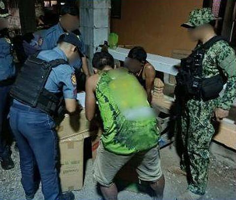 ZAMBOANGA. Policemen arrest an individual and seize some P1.4 million worth of smuggled cigarettes in a law enforcement operation Friday, April 17, in Purok 5, Kinudalan village, Lebak, Sultan Kudarat. (SunStar Zamboanga)