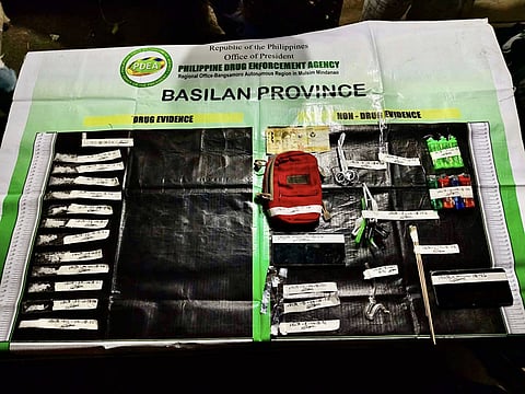 ZAMBOANGA. Lawmen arrest three high-value targets (HVTs) as they dismantle a drug den in an anti-drug operation Saturday, April 18, in Kulaybato village, Lamitan City, Basilan. 