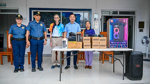 ILOILO. Police Colonel Wilbert Parilla (second from left) receives communication and logistical equipment from the Icpo Advisory Group for Police Transformation and Development during a flag-raising ceremony on April 27, 2026, at Camp Achilles D. Plagata, Iloilo City, to enhance police operations and public service delivery. 