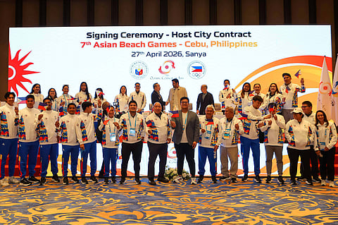 Philippine Olympic Committee President Abraham “Bambol” Tolentino (left) and Olympic Council of Asia President Sheikh Joaan bin Hamad Al Thani exchange signed documents during the host city contract signing ceremony for the 7th Asian Beach Games Cebu 2028 on Monday in Sanya, China.