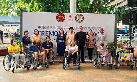 TURNOVER CEREMONY. Chinese Consul General Zhao Xiuzhen, Davao City Mayor Sebastian Duterte, and other city officials pose with beneficiaries during the ceremonial turnover of wheelchairs donated by the People’s Republic of China on Wednesday, May 20, 2026, at Rizal Park in Davao City. China donated 580 wheelchairs to support persons with disabilities in the city. 