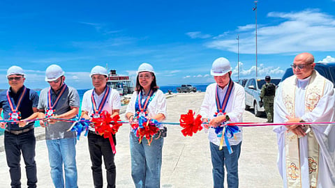 PORT REVIVAL. Government officials, led by Gov. Pamela Baricuatro (second from right), lead the ribbon-cutting ceremony for the reopening of Mainit Port in Oslob, southern Cebu, after 15 years of inactivity. Joining her are (from left) Francisco Comendador III, general manager of the Cebu Port Authority; Oslob Mayor Ronald Guaren; Rep. Edsel Galeos of Cebu’s 2nd District; and Paul Rodriguez, chief executive officer of Asian Marine Transport Corp.  / 