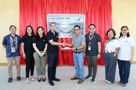 In the photo are Sol E. Solomon, Division Partnership Focal Person; Jenah Anne Mae D. Paclibar, Corporate Communications and Corporate Social Responsibility Manager- Agila Subic Compass, Inc.; Atty. Michelle Regala-Niebres, Head of Legal and Compliance- Agila Subic Compass, Inc.; Mark Glenn D. Millan, General Manager- Agila Subic Compass, Inc.; William Roderick R. Fallorin, CESO VI (Schools Division Superintendent); Ronald Ryan L. Sion, Chief, SGOD; Lilia B. Rosete, Public Schools District Supervisor; and Lerma A. Aranas (Principal IV).
(Standing from left) Dick C. Raguine, Head Teacher I- Cawag HS Resettlement; Janet V. Ramos, OIC- School Principal- Agusuhin ES Annex; Rey Anthony A. Miguel, Head Teacher III- Agusuhin HS; Mary A. Miana, Principal I- Cabitaugan IS;  Jaulino M. Bueno, Jr., Principal I- Cawag ES; Anabel S. Simbe, Principal I- Cawag Resettlement ES; Anna Liza M. Napoles, Asst. School Principal- Nagyantok ES; Maricel A. Gatdula, Head Teacher III- Nagyantok HS; and Anthony S. Villanueva, OIC- School Principal- Agusuhin ES.