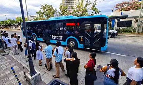 Queue for free bus rides along Roxas Avenue in Davao City on Tuesday, April 7, 2026. The city government's DC Bus has served more than 500,000 passengers since its launch in November 2025. Meanwhile, the national government's Love Bus has recorded a total ridership of 1.9 million since July 2025.