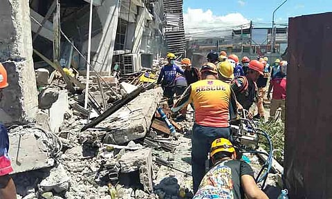 Rescuers are searching through the ruins of a partially collapsed building in General Santos City following a powerful earthquake in the southern Philippines. The magnitude 7.8 earthquake occurred on June 8, 2026, causing significant devastation in the region. As of June 9, 2026, the earthquake has resulted in at least 37 deaths and displaced over 32,000 people.