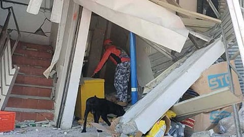 POST-QUAKE INSPECTION. A member of a specialized unit from the Philippine Coast Guard inspects a damaged commercial building in Barangay Calumpang, General Santos City, following the magnitude 7.8 earthquake that struck Sarangani province on Monday (June 8, 2026). Electricity in quake-affected areas of Mindanao is expected to be fully restored as early as Wednesday (June 10) through closer coordination among energy sector stakeholders, NEA Administrator Antonio Mariano Almeda said in an online briefing on Tuesday (June 9).