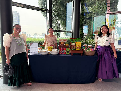 FILIPINO FLAVORS ABROAD. Philippine food exporters showcase artisanal chocolates, specialty snacks, and other locally made products at the “Taste of the Philippines” pavilion during the Philippines’ 128th Independence Day reception in Singapore. The exhibit aimed to promote Philippine food exports and connect local brands with international buyers and business partners