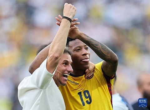 PITCH CELEBRATION. Ecuador head coach Sebastian Beccacece (left) and forward Gonzalo Plata raise their arms to celebrate their 2-1 victory over Germany in the final Group E match of the 2026 FIFA World Cup. Plata scored the winning goal in the 77th minute after sneaking ahead of his marker during a corner kick.  / 