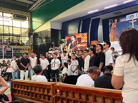 HONORING BOBET. Members of the Davao Region Palarong Pambansa 2025 and 2026 teams stand with the Baterbonia family during a Mass before the burial of Rene Clert "Bobet" Baterbonia on June 24, 2026, in Talacogon, Agusan del Sur. Baterbonia, an Ateneo de Manila University student-athlete, died June 8 during a team-building activity in Dipaculao, Aurora. 