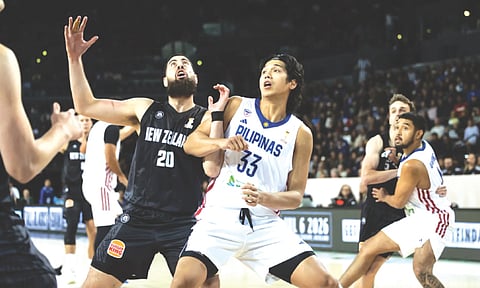FUTURE IS BRIGHT. Gilas Pilipinas forward Carl Tamayo (No. 33) battles for a rebound against New Zealand in the the Fiba Basketball World Cup 2027 Asian Qualifiers in Auckland. / FIBA FACEBOOK PAGE