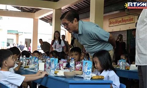 FEEDING PROGRAM. President Ferdinand R. Marcos Jr. joins the national kick-off of the School-Based Feeding Program (SBFP) and the Milk Feeding Activity at Pulilan Central School in Pulilan, Bulacan on Wednesday (July 8, 2026). The initiative is the government’s flagship school nutrition intervention implemented by the Department of Education pursuant to Republic Act 11037 or the Masustansyang Pagkain para sa Batang Pilipino Act. (RTVM screengrab)
