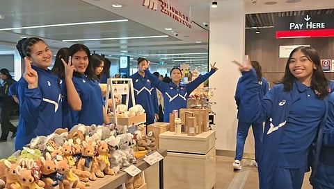 TEAM SPIRIT. Members of Alas Pilipinas Girls flash peace signs while stopping at a shop during a layover in Sydney, Australia, before continuing their journey to Santiago, Chile, for the FIVB Volleyball Girls’ U17 World Championship. The Philippines opens its campaign in Pool B on Aug. 6.