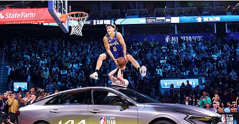 DUNK KING. Mac McClung dunks over a car in the NBA Dunk Contest.  / NBA