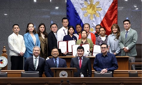 Members of the Senate of the Philippines, led by Senate President Juan Miguel Zubiri and fellow lawmakers, pose for a group photo with family members during a plenary session at the Senate building in Pasay City. The upper chamber adopted multiple resolutions honoring the late Ateneo student-athlete Rene Clert "Bobet" Baterbonia and students affected by a recent tragic school shooting, presenting official copies of the measures to the bereaved families.