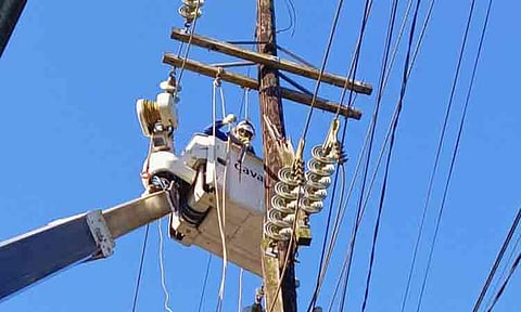MODERNIZING THE GRID. Davao Light crews rehabilitate power lines in the Island Garden City of Samal as the utility upgrades the distribution network to provide safer and more reliable electricity to homes, businesses and tourism establishments. 