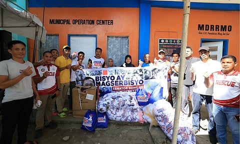 Rescue personnel and community members gather outside the Municipal Disaster Risk Reduction and Management Office (MDRRMO) in General Salipada K. Pendatun, Maguindanao del Sur, Philippines, during a relief distribution activity. The outreach event, supported by the office of Philippine Senator Bong Go, included the turnover of essential supplies and financial assistance to local beneficiaries.
