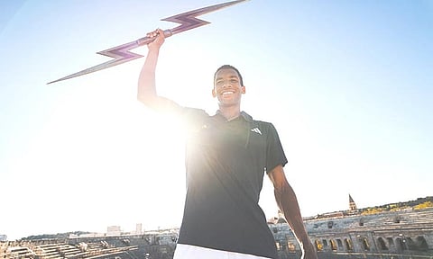 EALA PARTNER. Canadian Felix Auger-Aliassime holds up a stylized lightning bolt prop during a promotional appearance. He will be Alex Eala’s partner in the US Open mixed doubles tournament. / 