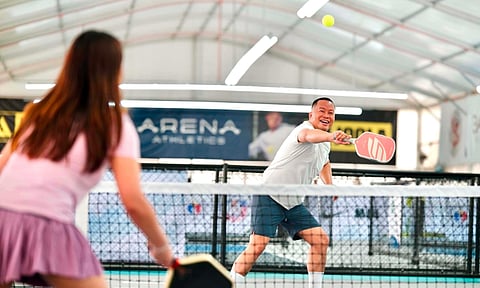University of the Philippines Diliman alumnus Clevin Joy G. Conde returns a shot during a pickleball competition at The Arena Athletics along Carlos P. Garcia Highway (Diversion Road) in Davao City on Sunday. 
