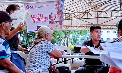 NO DELAYS. National Commission of Senior Citizens personnel in the Davao Region distribute cash incentives to senior citizens aged 80, 85, 90, 95, and 100 years old under the Expanded Centenarian Act in this Dec. 17, 2025 photo. Malacañang on Wednesday (Aug. 26) assured senior citizens that government benefits due to them would not be unnecessarily delayed. (PNA photo by Robinson Niñal Jr.)