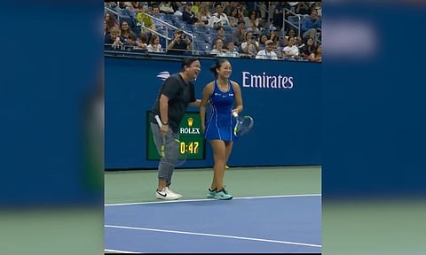 Alex Eala and Iva Jovic share a lighthearted moment with their fathers, Mike Eala and Bojan Jovic, during the US Open’s “Stars of the Open” exhibition at Arthur Ashe Stadium in New York on Thursday, Aug. 27, 2026. 
