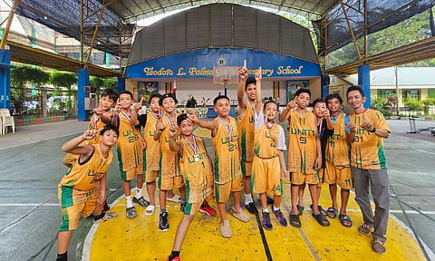 BASKETBALL CHAMPIONS. Davao Central District elementary boys basketball team celebrates after winning the Unit 1 Meet 2026 championship with an 81-37 victory over Sta. Ana District on Sept. 8 at Teodoro Palma Gil Elementary School in Davao City. 

