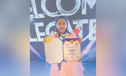 Young journalist Maxine Dy is also a Math Olympiad. / contributed