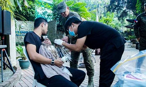Philippine Eagle Center personnel conduct an initial assessment of the rescued juvenile White-bellied Sea Eagle following its arrival from Basilan for specialized care and rehabilitation.
