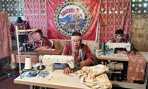 Members of the Binugao Bagobo-Tagabawa Women's Association (BIBATAWA) demonstrate traditional garment making and textile design at their livelihood hub in Toril District. Supported by community development partnerships with local power firms, the indigenous-led group utilizes modern sewing technology to preserve ancestral Inabal weaving styles and intricate embroidery, transforming cultural heritage into sustainable economic opportunities for women in the region.