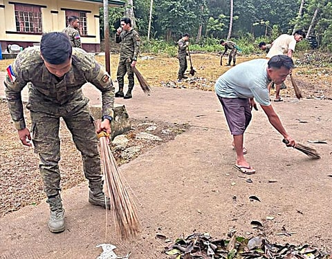 ZAMBOANGA. Troops of the 21st Infantry Battalion and barangay officials bring basic services closer to residents of Asin village, Panamao, Sulu Thursday, September 17, through a community clean-up drive, feeding activity and free haircut service. 