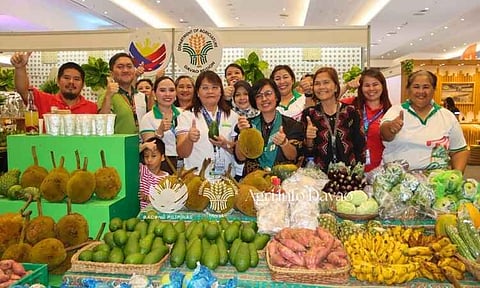 AGRI INNOVATION. Department of Agriculture (DA) Davao regional technical director for operations Marie Constantino, center, joins agriculture workers and exhibitors in showcasing local farm products during the 28th Davao Agri Trade Expo in Davao City. The event highlights efforts to strengthen agricultural value chains, promote innovation, and expand market opportunities for farmers and producers. 