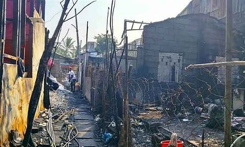 The charred remains of homes along Cervantes Street in Barangay 15-B, Davao City, stand in ruins following a devastating fire shortly after noon on September 14. The third-alarm blaze affected 39 families, totaling 146 individuals, and tragically claimed the life of 21-year-old Francis Dayot while injuring two others.