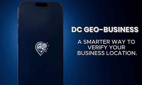 A promotional graphic for the DC Geo-Business mobile application shows the app's official logo displayed on a smartphone screen next to bold text reading "A SMARTER WAY TO VERIFY YOUR BUSINESS LOCATION." Released by developer Rhence Paradela, the digital mapping and zoning verification tool is designed to allow local entrepreneurs to accurately register, photograph, and confirm their physical storefront locations.