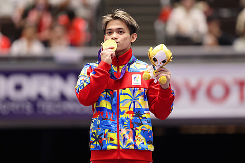 GOLDEN AGAIN. Carlos Yulo kisses his gold medal after ruling the men’s vault final at the 2026 Asian Games in Nagoya, Japan, Friday, Sept. 25. Yulo added the vault gold to his men’s floor exercise title won Thursday, giving the Philippines its second gold medal of the Games. 
