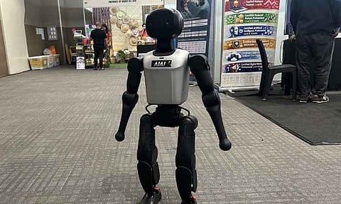 An artificial intelligence-powered humanoid robot is showcased during an exhibition highlighting emerging technologies. The demonstration, part of a local government initiative exploring smart city integration, presented potential applications for AI and robotics in public administration, tourism, and cybersecurity.