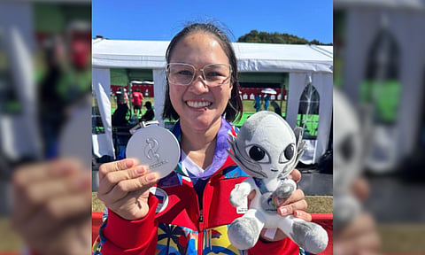 HISTORIC SILVER. Philippine archer Amaya Amparo Cojuangco displays her silver medal and the 2026 Asian Games mascot after winning silver in the women’s individual compound event in Japan on Thursday, Oct. 1, 2026. Cojuangco became the first Filipino archer to reach an Asian Games gold-medal match. 
