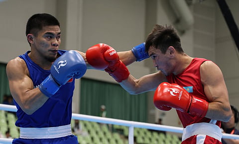 FIGHTING BACK. The Philippines’ Carlo Paalam lands a punch on Japan’s Rui Yamaguchi during their men’s 55-kilogram gold-medal bout at the 2026 Asian Games in Nagoya, Japan, Friday, Oct. 2, 2026. Paalam dropped a 3-2 split decision to Yamaguchi and won the silver medal. 
