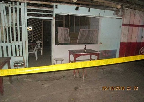 Police cordon the area where an American was shot to death by a drunk man at Silay City, Negros Occidental Tuesday night, May 15. (Contributed Photo)