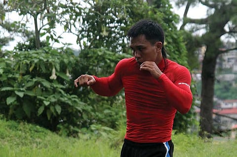 BAGUIO. Team Lakay's Kevin Belingon holds an early morning workout in Baguio City as he starts his tough grind in his quest for the bantamweight world title against Martin Nguyen. (Roderick Osis)