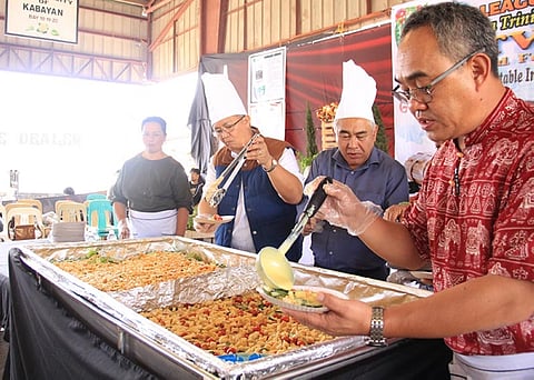 BENGUET. Benguet officials sample a serving of the vegetable salad during the celebration of the highland vegetable week last month. La Trinidad Councilor Roderick Awingan is moving to institutionalize the celebration as a tribute to the main economic driver of the municipality. Photo by Lauren Alimondo