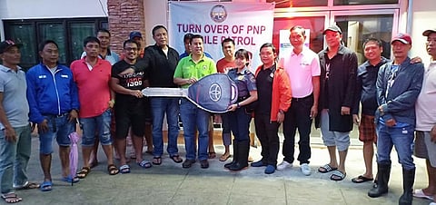 PAMPANGA. Fourth district Representative Juan Pablo "Rimpy" Bondoc turns over the symbolic key of the brand new PNP mobile patrol car to Masantol deputy police chief Onicima Tayson and Mayor Danilo Guintu. With them are Board Member Rolando "Pol" Balingit, SB members and barangay chairmen. (Contributed photo)