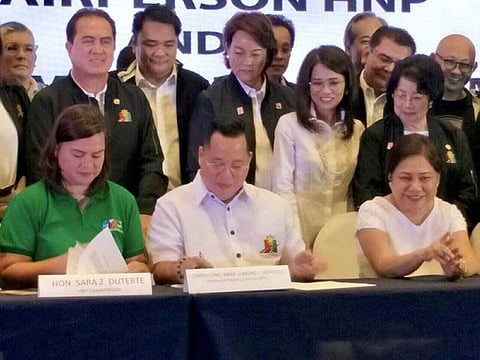 BACOLOD. Nationalist People's Coalition district chair Bacolod City Representative Greg Gasataya (standing, 3rd from left) was among the NPC members who joined the Hugpong ng Pagbabago regional party of Presidential daughter Davao City Mayor Sara Duterte-Carpio during the signing of a coalition agreement between the two political parties held at Blue Leaf Filipinas in Paranaque City, Monday, August 13. (Contributed Photo)