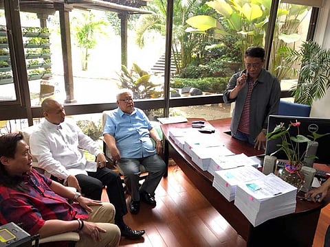 MANILA. Opposition lawmakers, from left, Ifugao Rep. Teddy Baguilat, Magdalo Rep. Gary Alejano and Albay Rep. Edcel Lagman file the impeachment complaints against 7 associate justices of the Supreme Court before interim House secretary general Robert Maling at the House of Representatives on August 23, 2018. (Contributed Photo)