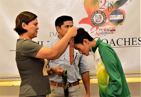 DAVAO. Davao City Mayor Sara Duterte Carpio awards a medal to Palarong Pambansa champion Delmar Gato of Sto. Nino National High School, an orthopedic athlete, during recognition rites at The Royal Mandaya Hotel on Thursday, August 23. (Photo courtesy of Seth Delos Reyes) 