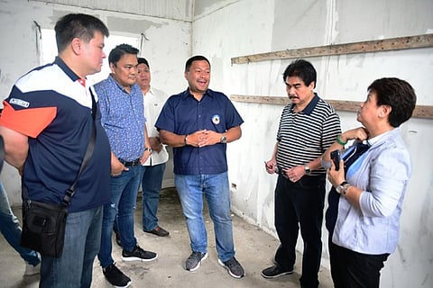 BACOLOD. Senator Joseph Victor "JV" Ejercito (3rd from right), chair of the Senate committee on urban planning, housing, and resettlement, along with Bacolod Mayor Evelio Leonardia (2nd from right), Bacolod Rep. Greg Gasataya (2nd from left), Silay City Mayor Mark Golez (left), E.B. Magalona Mayor Marvin Malacon (3rd from left), and assisted by National Housing Authority project implementation team head Susana Nonato (right), inspects the government housing site in Barangay Felisa, Bacolod City Friday. (Bacolod City PIO)