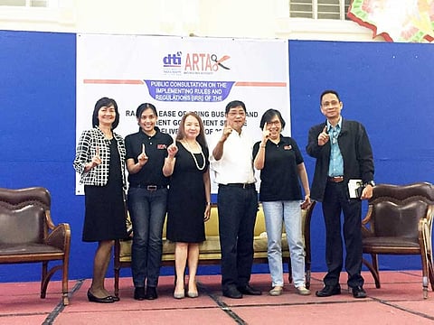 PAMPANGA. (L-R) DTI-Central Luzon Assistant Regional Director Zorina Aldana, CSC-Central Luzon Counsel Jamahlin Escalona, CSC Director Luisa Agamata, Mayor Edwin Santiago, DTI Assistant Secretary Mary Jean Pacheco and CSC-3's Nelson Sarmiento flash the "Fernandino First" sign after the public consultation on the Implementing Rules and Regulations of RA 11032 at Heroes Hall recently. (Princess Clea Arcellaz)