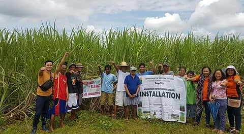 BACOLOD. The newly-installed ARBs of Barangay Binubuhan in Bago City with the personnel of DAR-Negros Occidental II during the installation rites Friday, September 21. (Contributed photo)