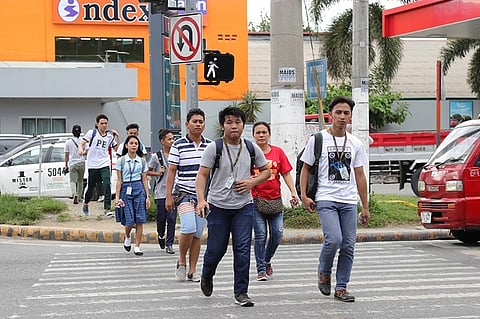 DAVAO. Law-abiding citizens follow traffic rules and regulations by crossing the street using the pedestrian lane in JP Laurel Avenue, Davao City.