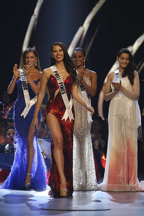 Miss Philippines Catriona Gray, second from left, walks on the stage during the final of 67th Miss Universe competition in Bangkok, Thailand, Monday, Dec. 17, 2018.(AP Photo)