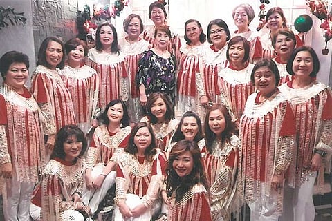 The scintillating Zontians In their official caroling getup, a capelet with cascading silver and white glitters, designed by Zontian Myrna Tan.